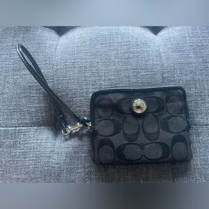 Coach black wristlet with pink interior